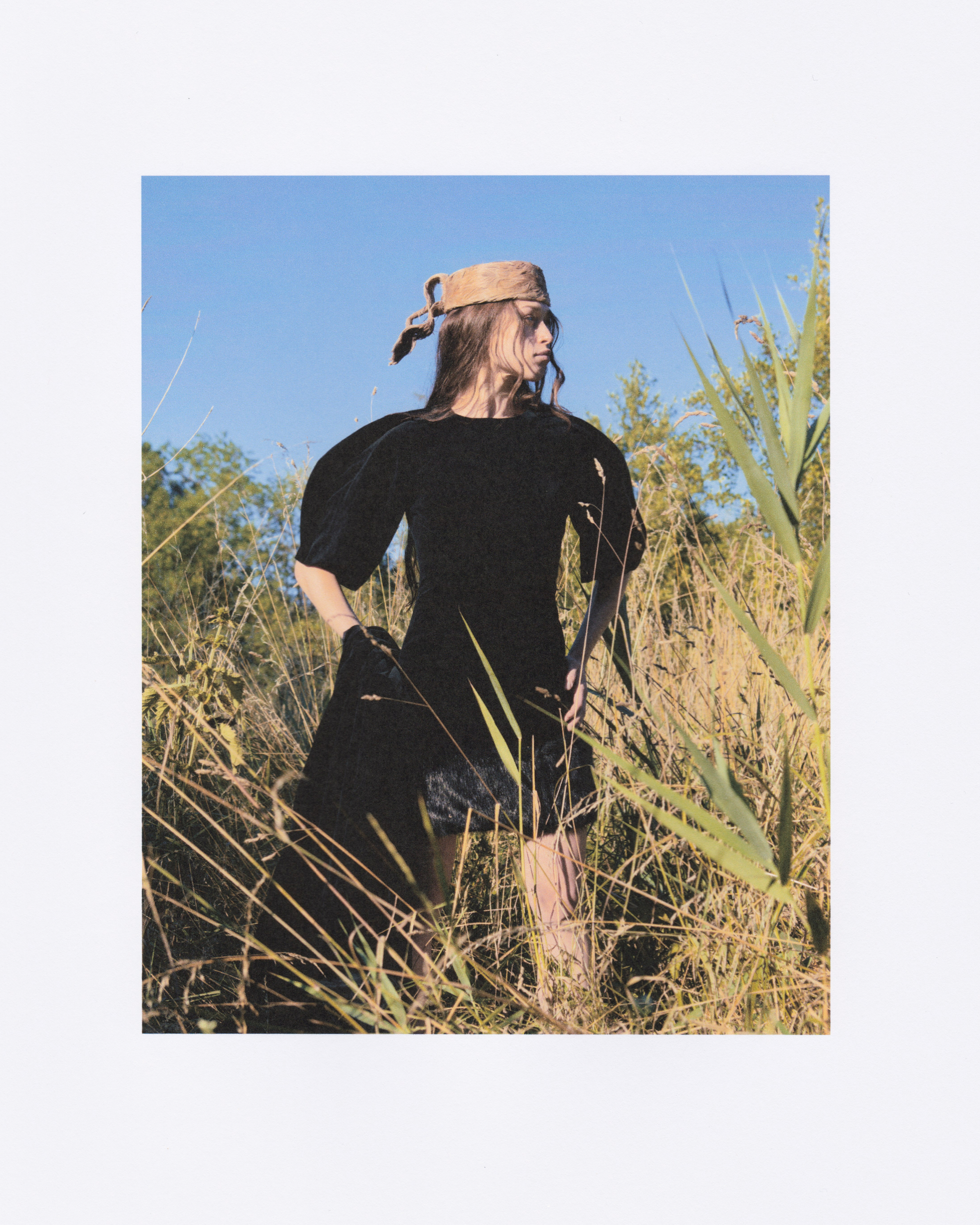 Toque with knot made of leftover coffee stained goose feathers